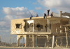 Children play atop a bullet-riddled building in Gaza UN multimedia