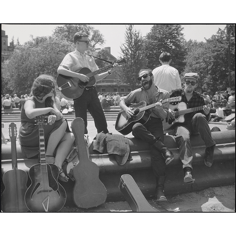 Bearded guitarist with other musicians, Washington Square Park