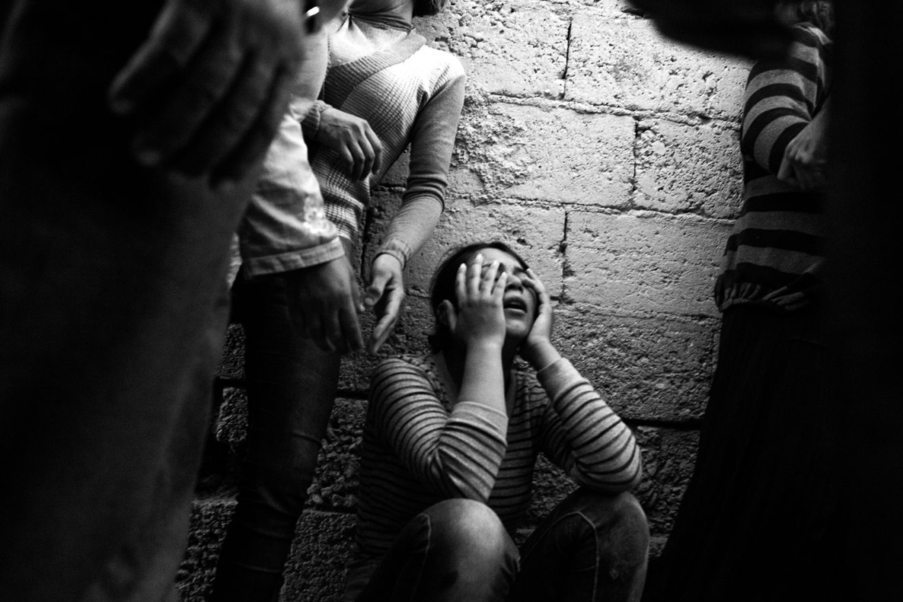 A woman mourning her husband, who was electrocuted by faulty wiring at a construction site where they had been living. October 7, 2014. Suruç, Şanlıurfa, Turkey.