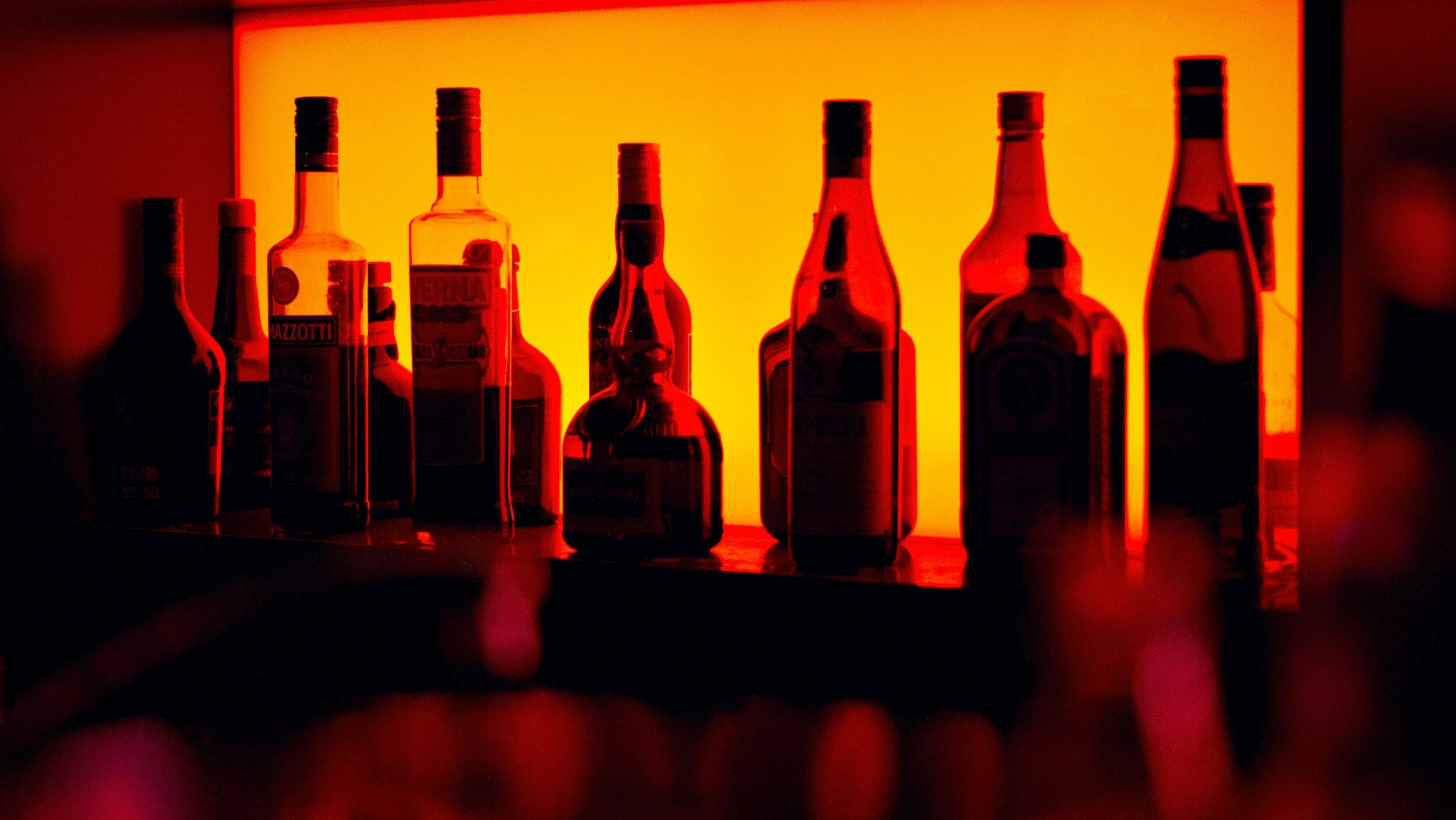 Assorted alcohol bottles in a bar